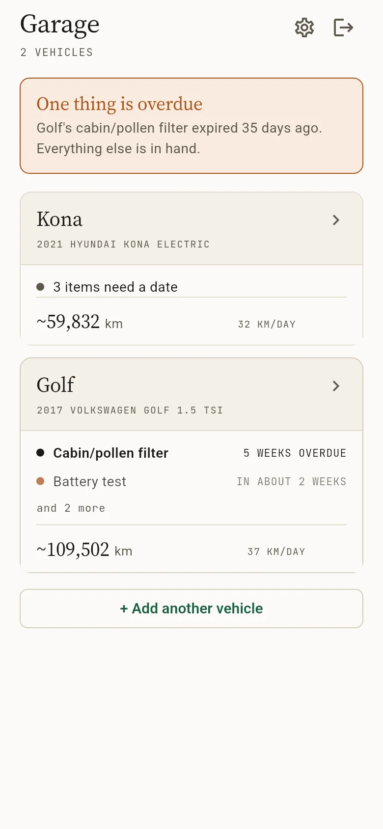The garage, listing a Kona and a Golf with their estimated odometers and what needs attention
